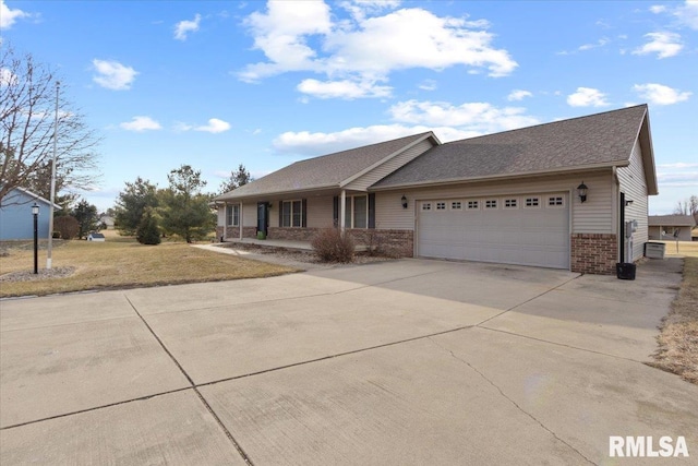 single story home featuring a garage and a front lawn