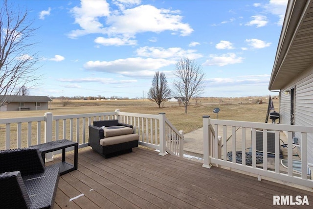 wooden deck with central AC unit and a rural view