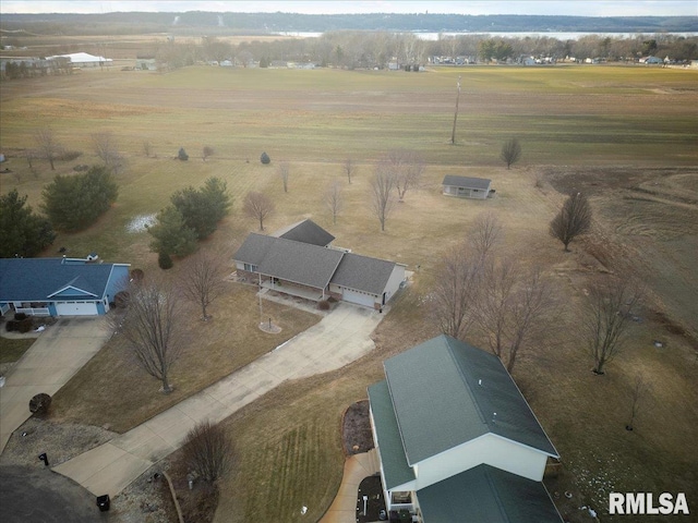 birds eye view of property with a rural view