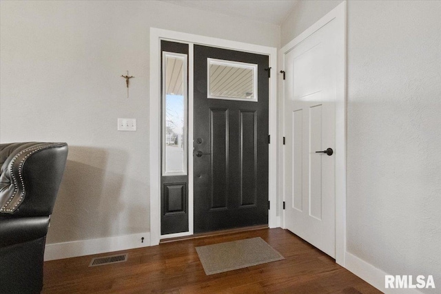 entrance foyer featuring dark wood-type flooring