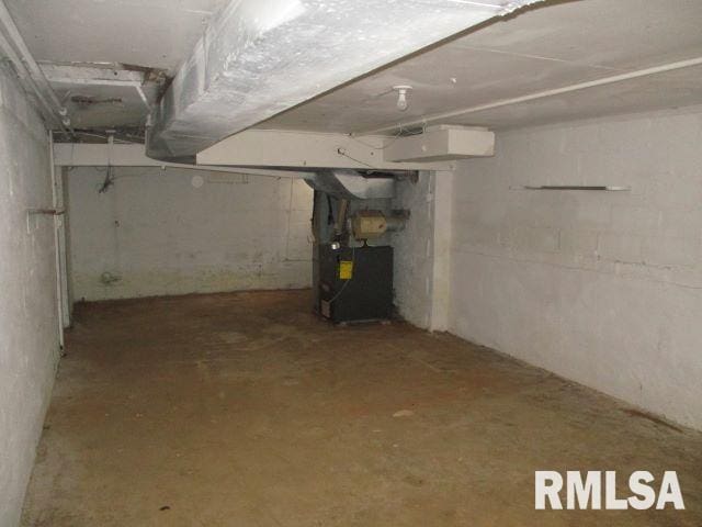 basement featuring heating unit