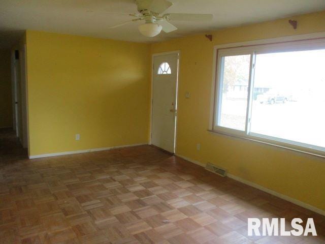 entrance foyer featuring ceiling fan and light parquet flooring