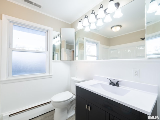 bathroom with toilet, vanity, a baseboard heating unit, a shower, and ornamental molding