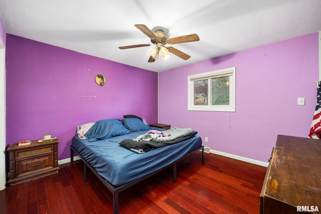 bedroom featuring ceiling fan and dark wood-type flooring