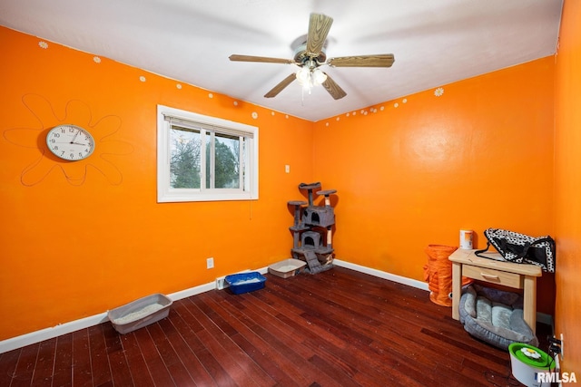 miscellaneous room with ceiling fan and dark hardwood / wood-style flooring