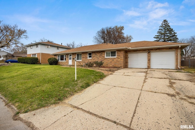 view of front facade with a front yard and a garage