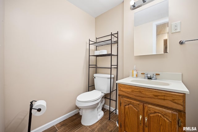 bathroom featuring toilet and vanity