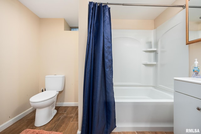 full bathroom with toilet, vanity, and shower / bath combo with shower curtain