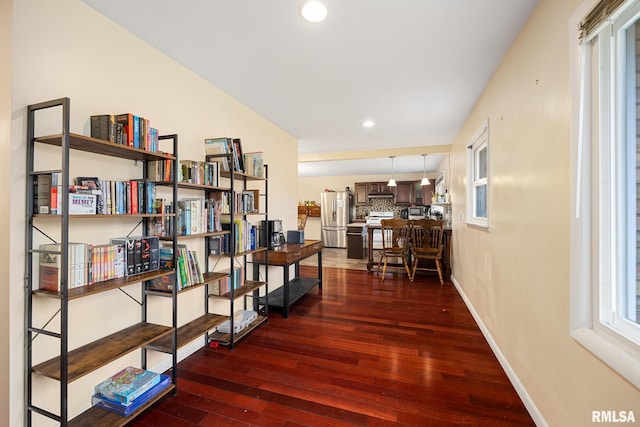 hallway featuring dark hardwood / wood-style flooring