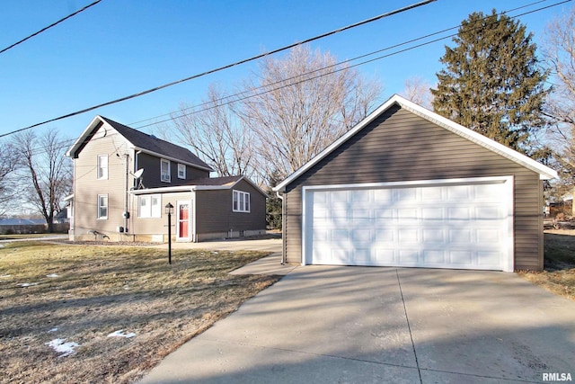 view of side of property with an outbuilding and a garage