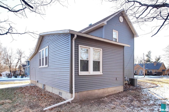 view of side of home featuring central air condition unit