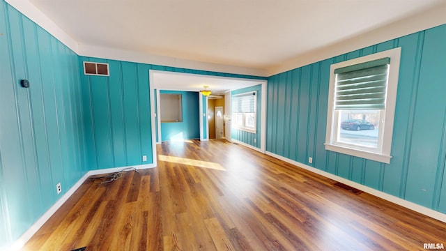 empty room featuring hardwood / wood-style flooring