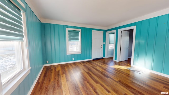 empty room featuring dark wood-type flooring