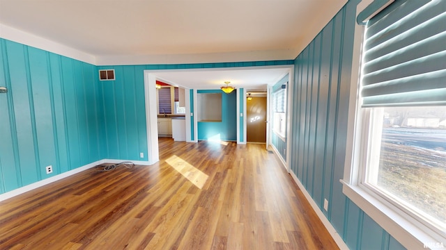 spare room with light hardwood / wood-style floors