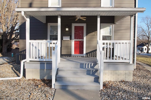 view of exterior entry with ceiling fan