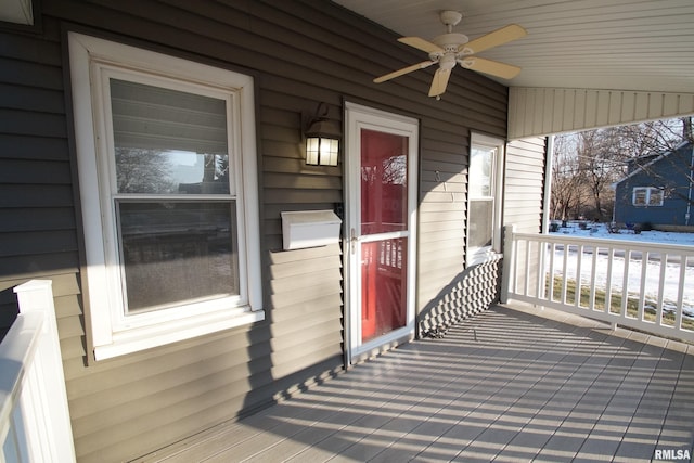 wooden deck with ceiling fan