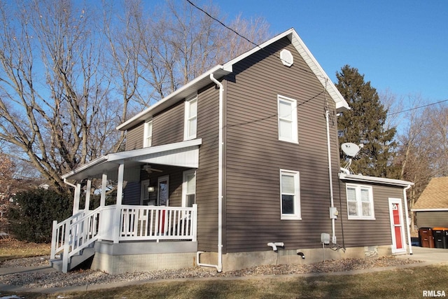 view of side of home featuring a porch