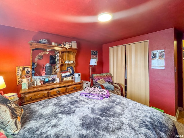 bedroom featuring a closet and carpet floors