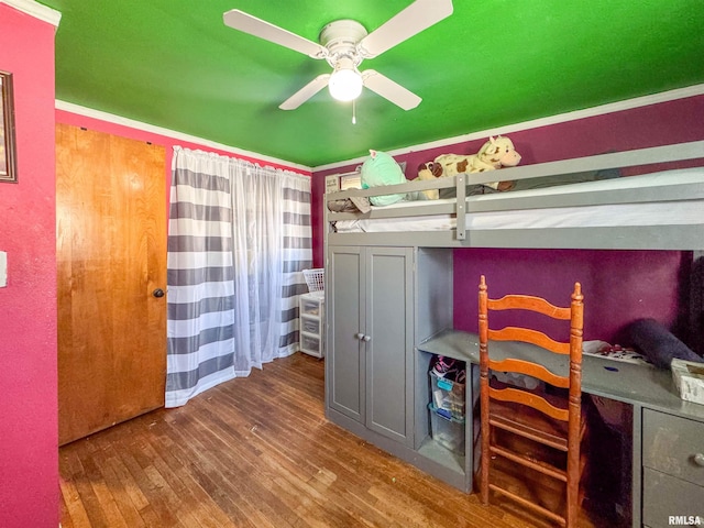 bedroom featuring ceiling fan and dark hardwood / wood-style flooring