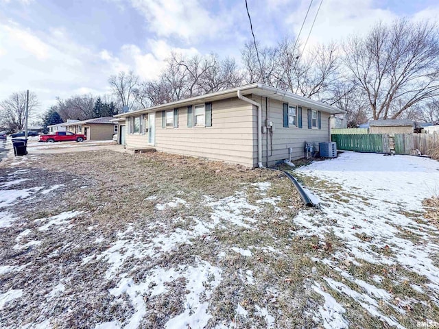 single story home featuring central air condition unit