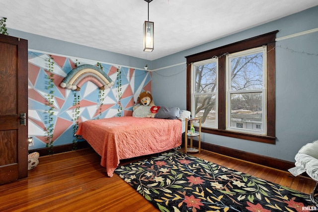 bedroom with hardwood / wood-style floors