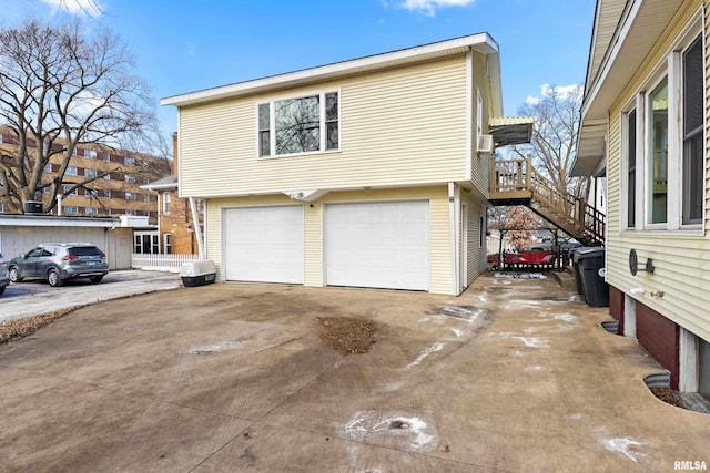 view of side of home featuring a garage