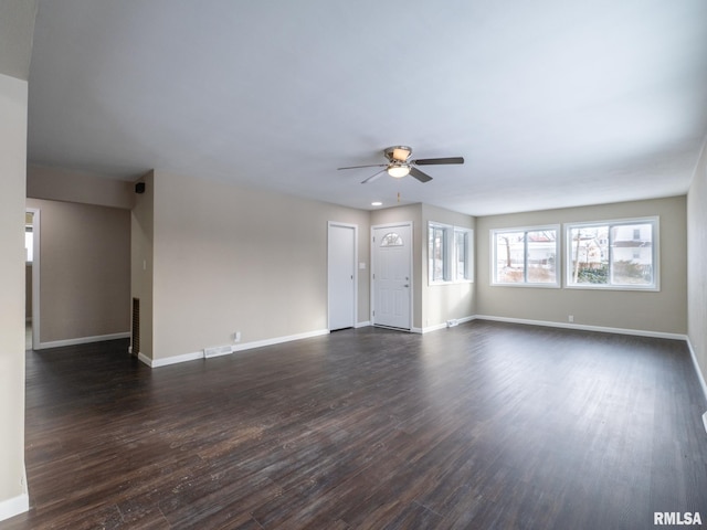 unfurnished living room with ceiling fan and dark hardwood / wood-style flooring