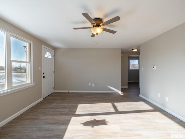 entrance foyer featuring dark wood-type flooring and ceiling fan