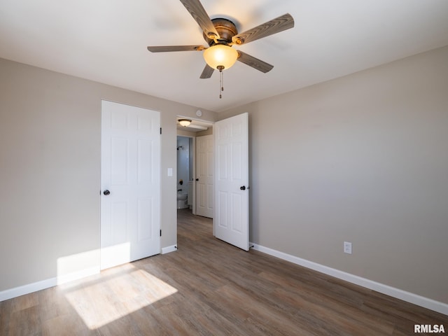 unfurnished bedroom featuring hardwood / wood-style flooring and ceiling fan