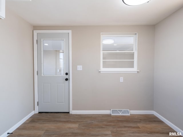 doorway with wood-type flooring