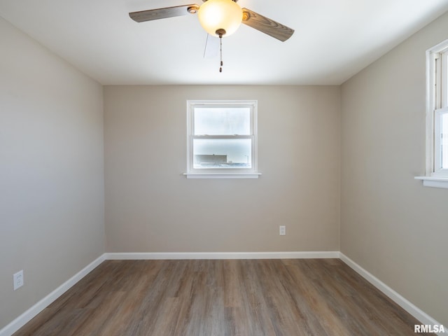 unfurnished room featuring ceiling fan and hardwood / wood-style floors