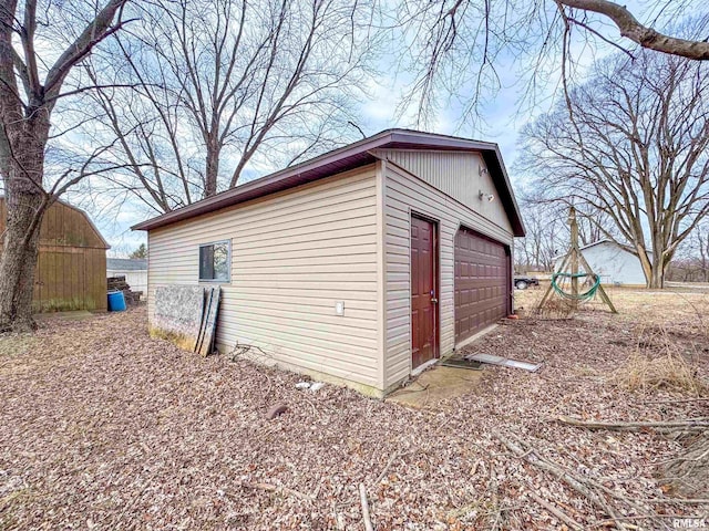 view of outbuilding featuring a garage