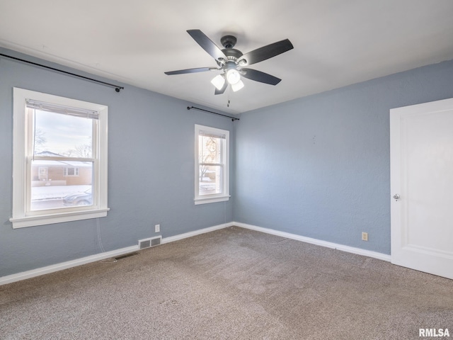 carpeted empty room with ceiling fan