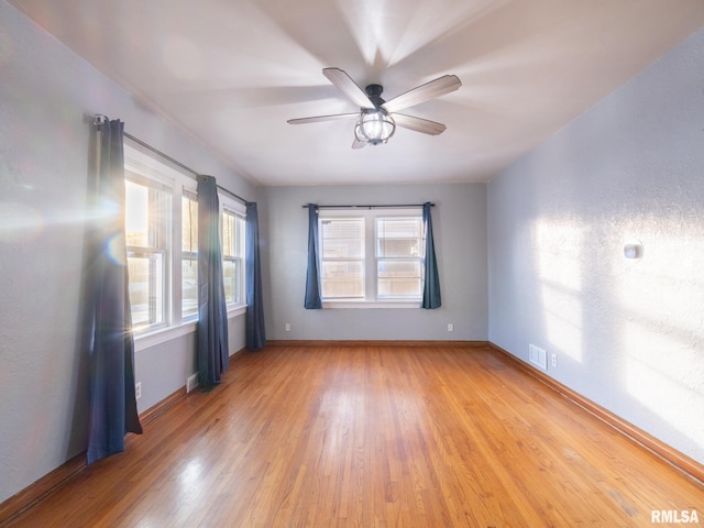 unfurnished room featuring wood-type flooring and ceiling fan