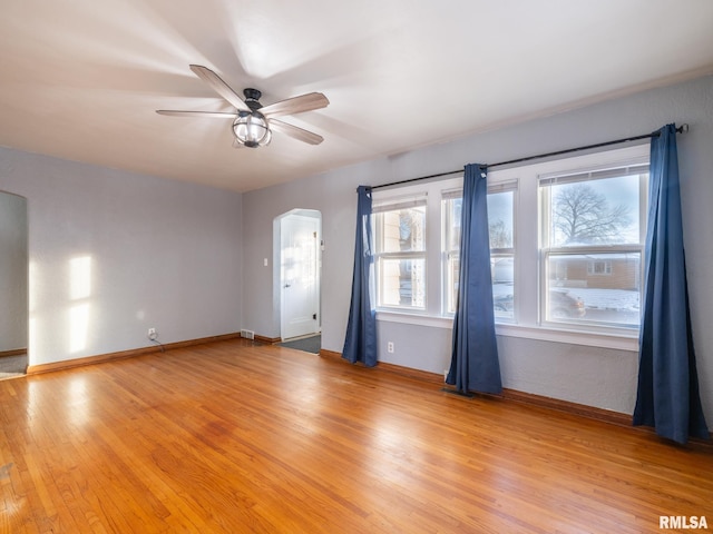 spare room with light hardwood / wood-style flooring and ceiling fan