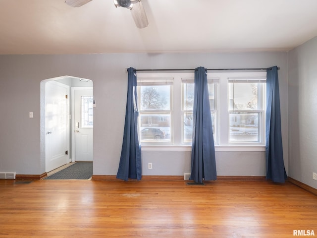 interior space featuring wood-type flooring and ceiling fan