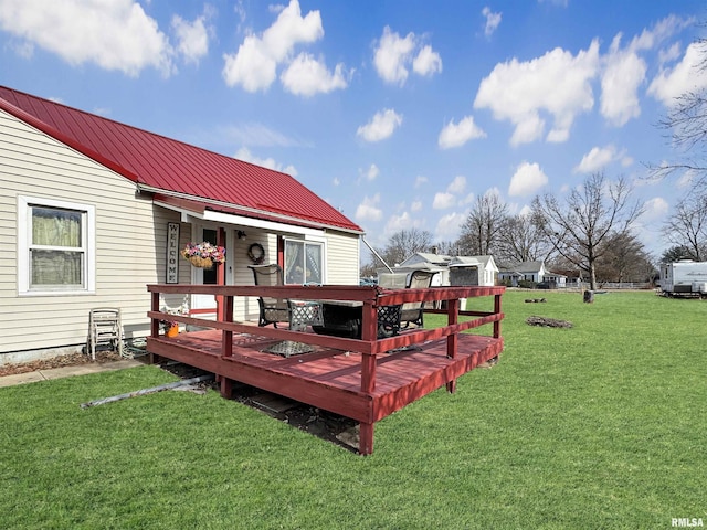 wooden terrace with a yard