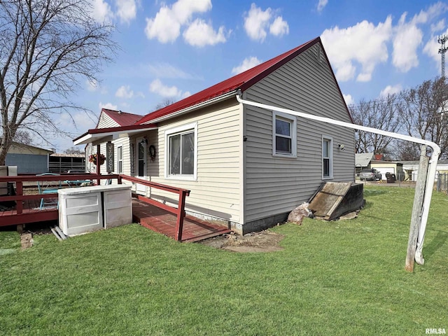 rear view of house with a lawn