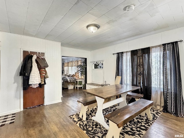 dining room with dark hardwood / wood-style floors