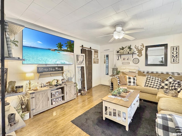 living room featuring ceiling fan and dark hardwood / wood-style flooring