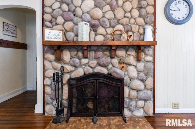 interior details with hardwood / wood-style floors and a fireplace