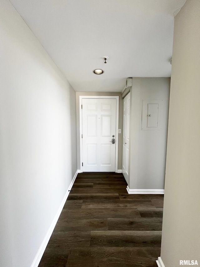 hall with electric panel and dark hardwood / wood-style flooring