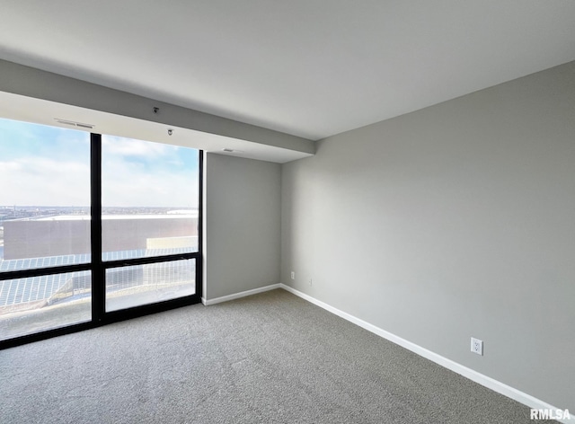 spare room featuring carpet floors and a water view