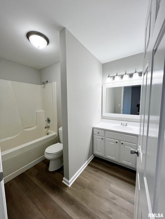 full bathroom featuring wood-type flooring, toilet, shower / tub combination, and vanity