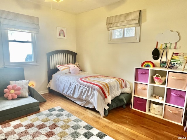 bedroom with hardwood / wood-style flooring