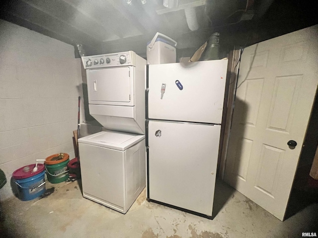 laundry area featuring stacked washer and clothes dryer