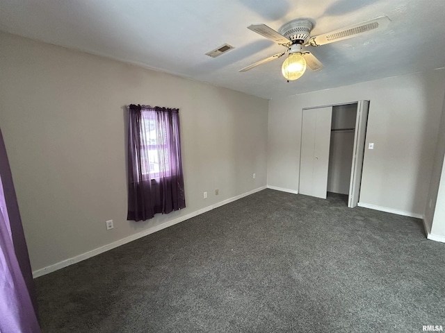 unfurnished bedroom featuring a closet, ceiling fan, and dark colored carpet