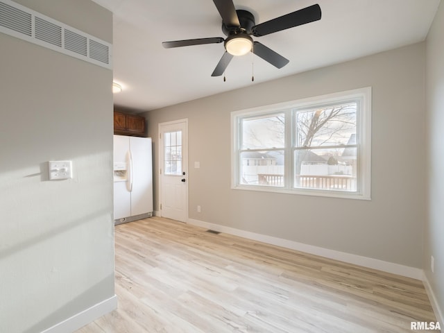 interior space with light hardwood / wood-style floors, plenty of natural light, and ceiling fan