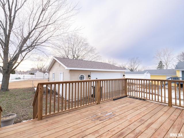 wooden terrace with a garage