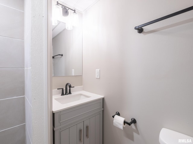 bathroom with toilet and vanity